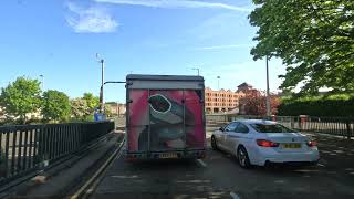 back of a colourful convoy van on the road