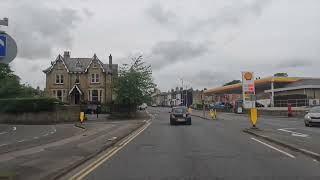 street with large house and petrol station