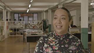 woman stood up inside office 