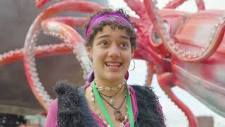 a person stood in front of a model of a giant squid