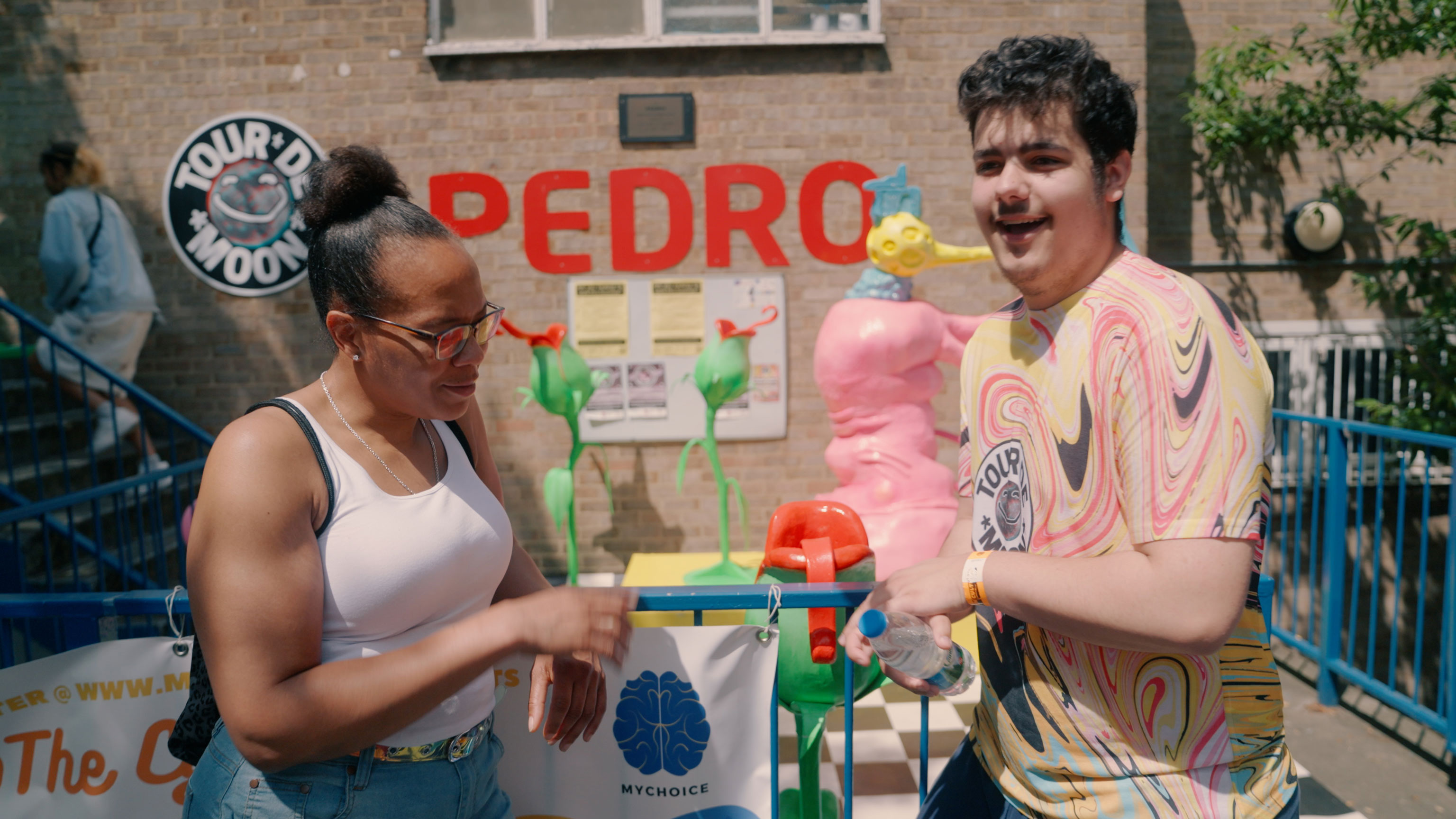 Natasha Patterson and Leon in front of Pedro Youth Club at the Tour de Moon FInale.