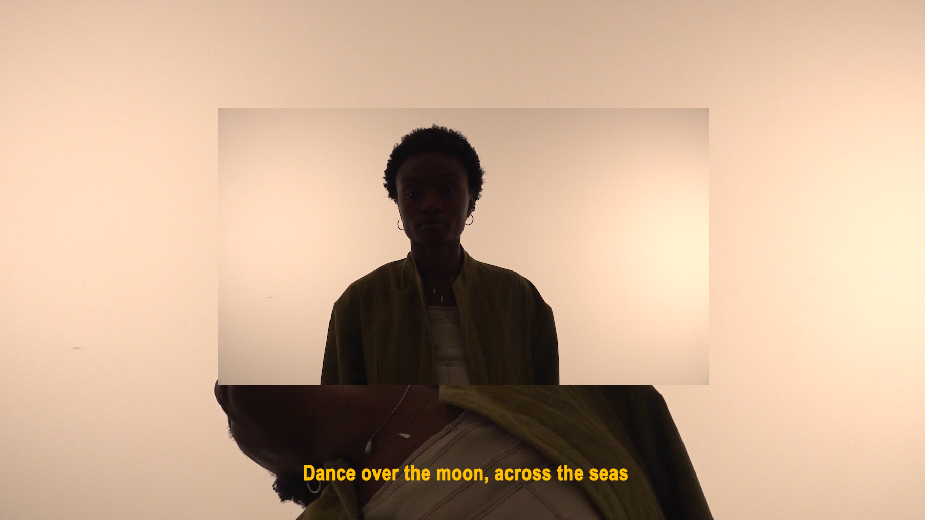 short film still of person in a light-filled space