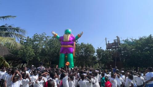 Crowd around giant inflatable space person